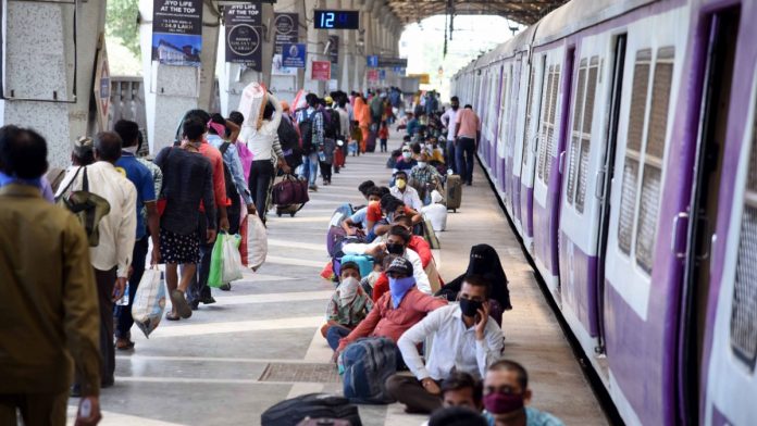 Shramik train Migrants from Lucknow wait to board Shramik Special train to reach their native places at Panvel Railway Station, during the ongoing Covid-19 lockdown, in Navi Mumbai, on 20 May | PTI